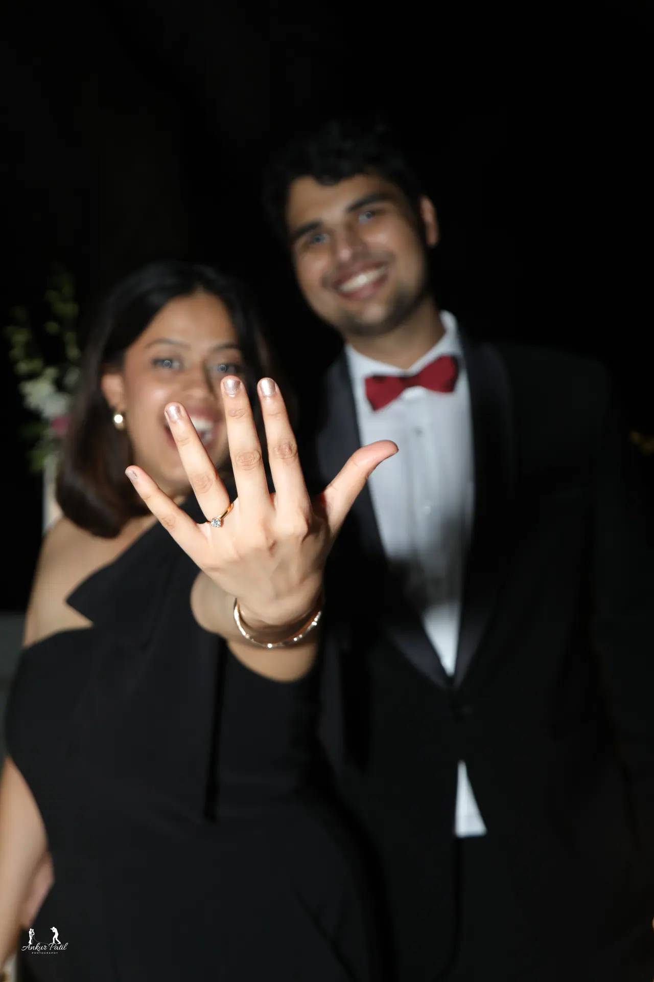 Nina and Jason celebrating the proposal