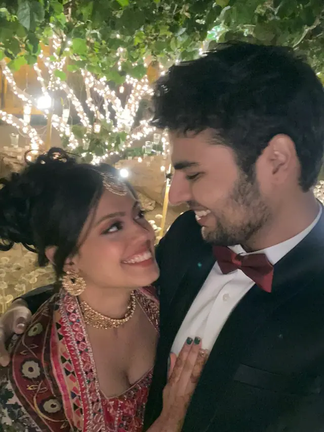 Nina and Jason together under lights
